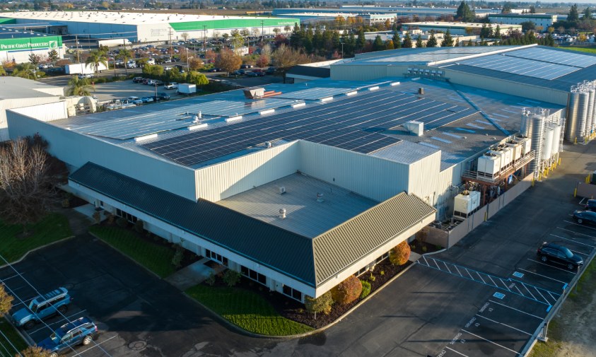 Aerial view of the SSI plant in Lodi, California, with solar panels covering the roof